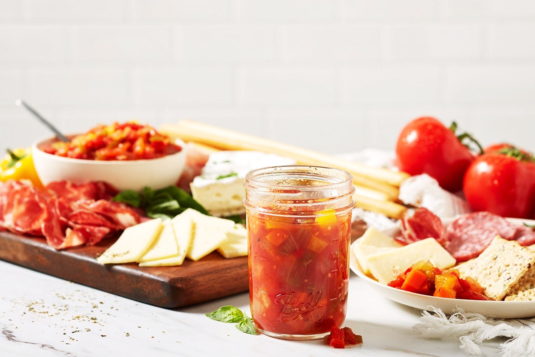 Mediterranean antipasti and gourmet jarred items with olives, marinated vegetables, and preserved specialties made from high-quality ingredients.