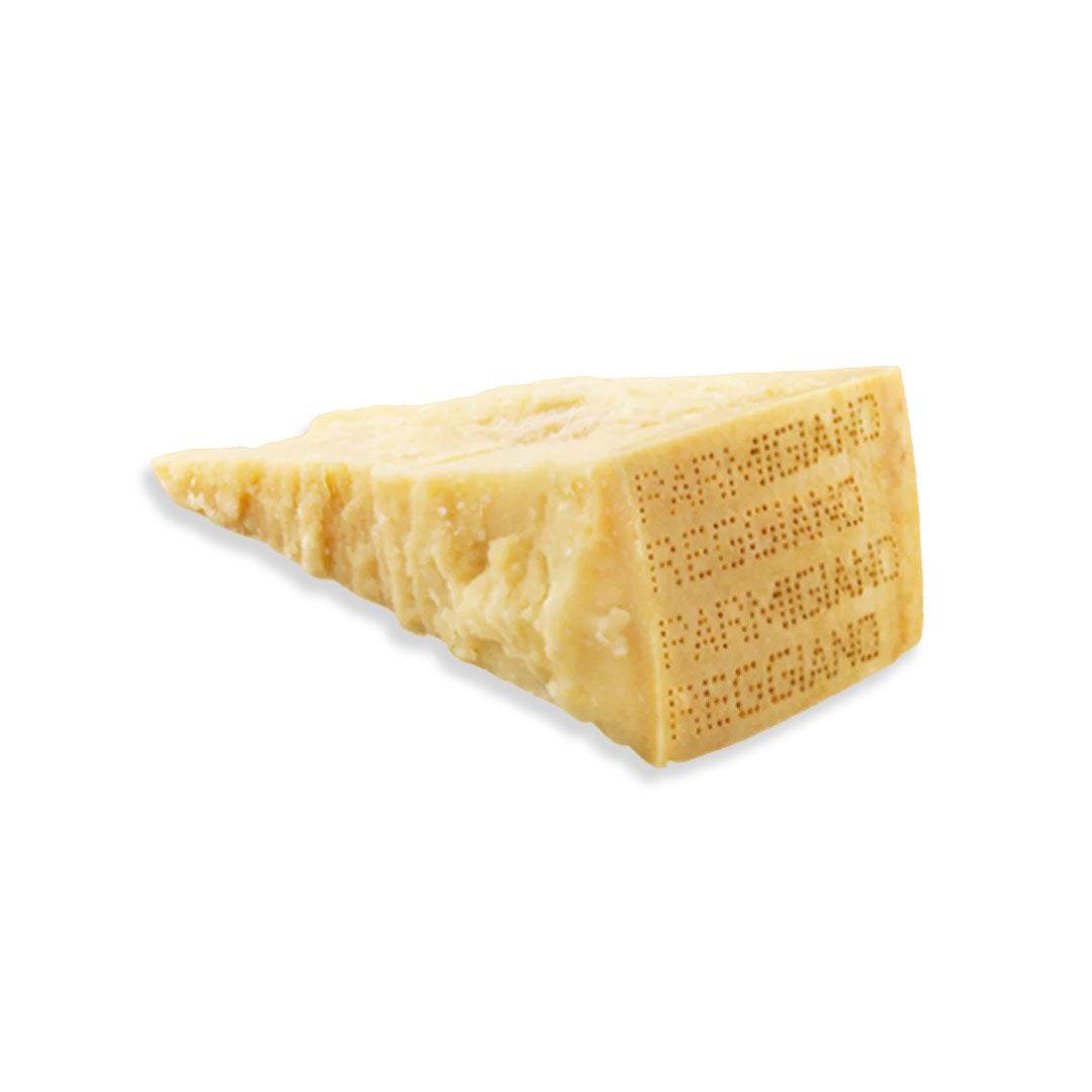 Aged Parmigiano Cheese wedge with firm texture and nutty flavor on wooden board