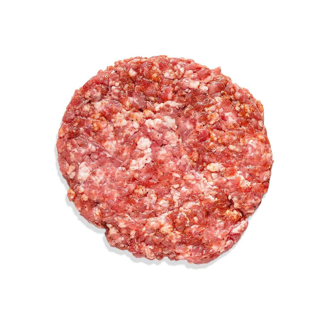 Juicy grass-fed beef burger with cheddar, caramelized onions, and brioche bun