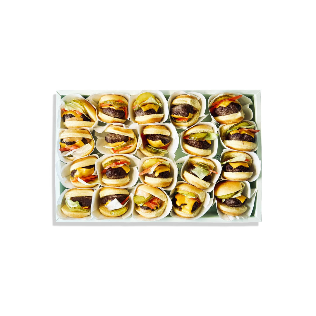 Box of mini burgers in a grid on a white background