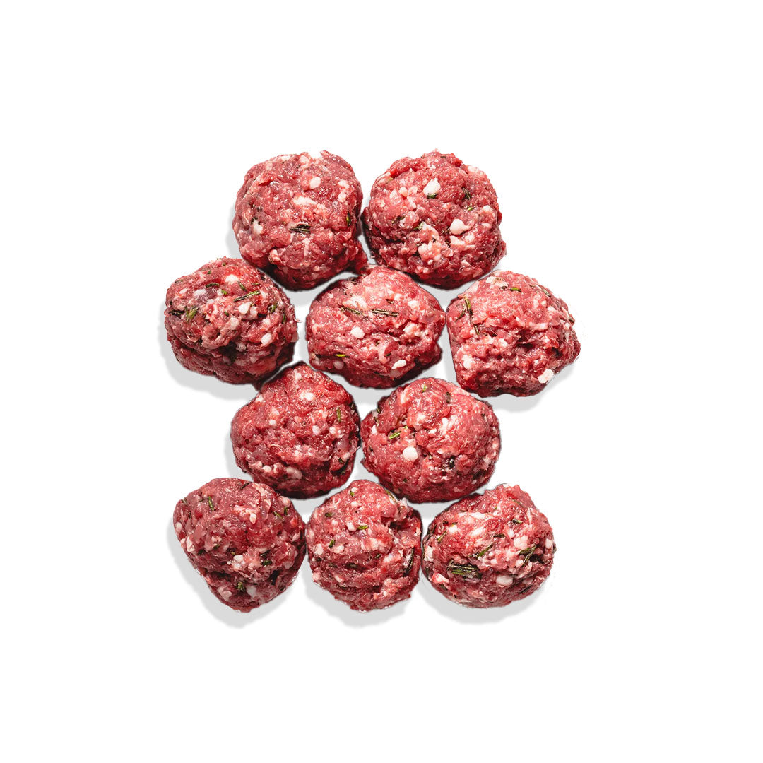 Raw meatballs on a white background