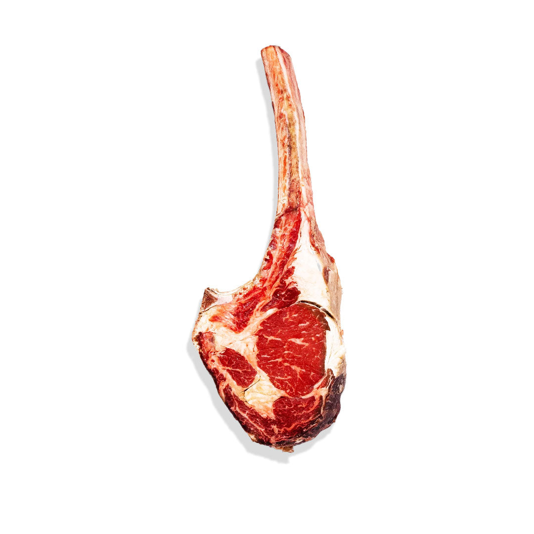 Raw tomahawk steak on a white background