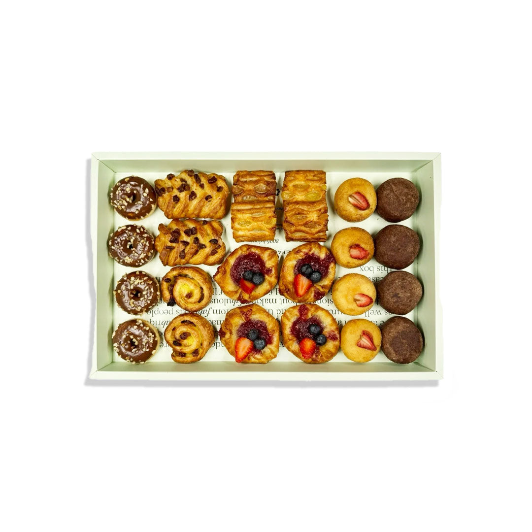 Assorted pastries in a box on a white background