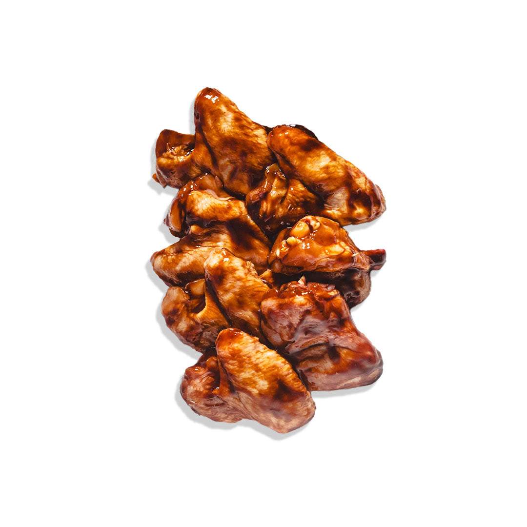 BBQ chicken wings glazed with smoky sauce served hot with ranch dip