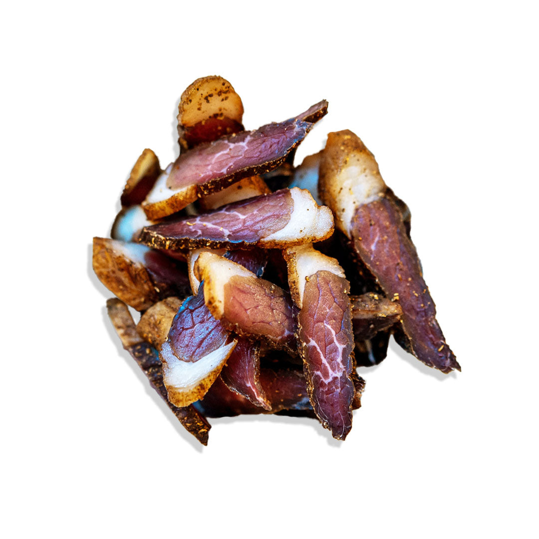 Dried meat slices on a white background