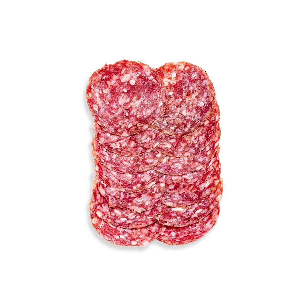 Artisanal beef salami sliced on a grazing board with cheeses and crackers