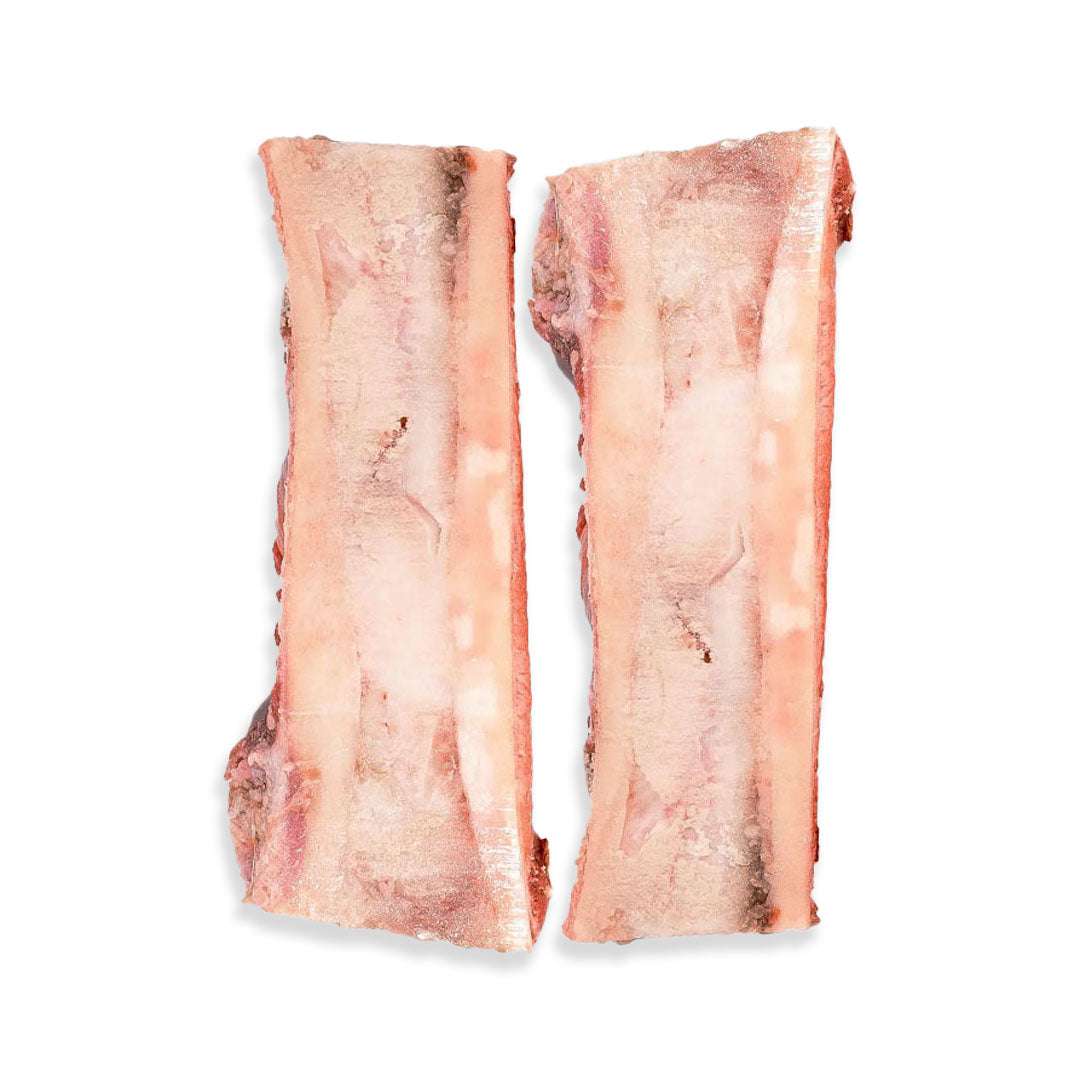 Two pieces of raw bacon on a white background