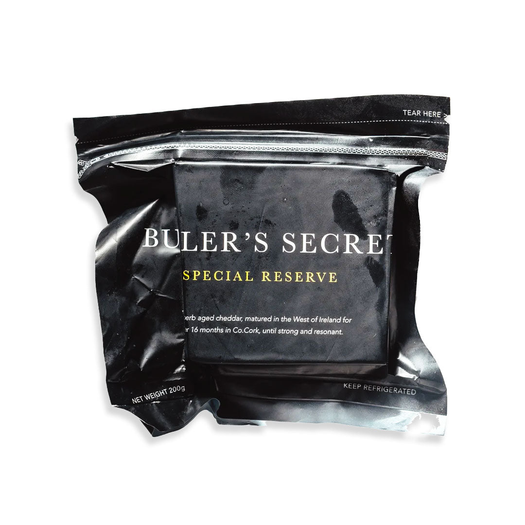 Black packaging of Buler's Secret Special Reserve cheese on a white background