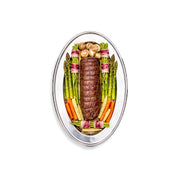 Decorative arrangement of meat and vegetables on a white background