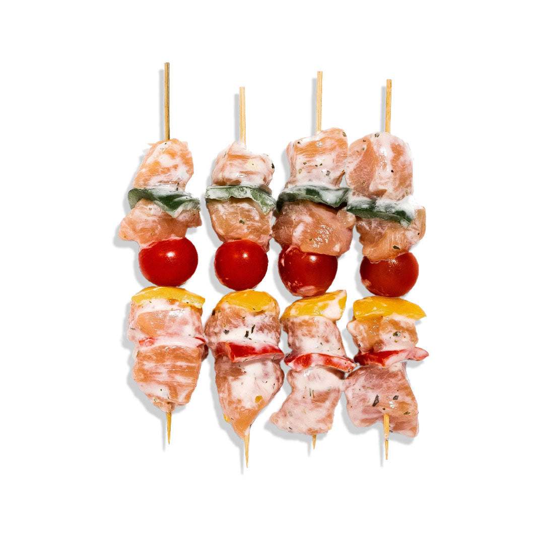 Juicy chicken BBQ skewers grilled with smoky glaze, served with coleslaw and corn on the cob