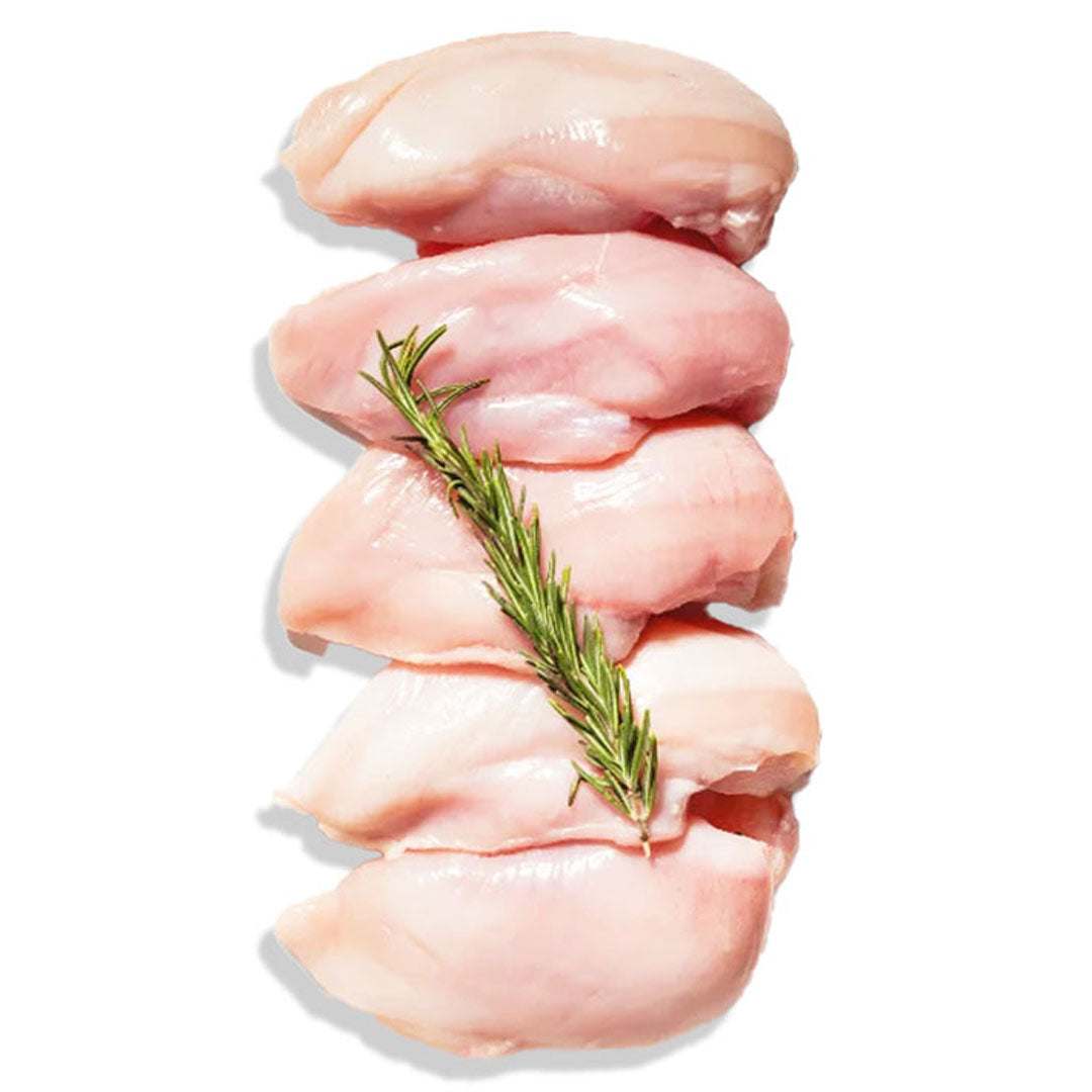 Raw chicken breasts with a sprig of rosemary on a white background