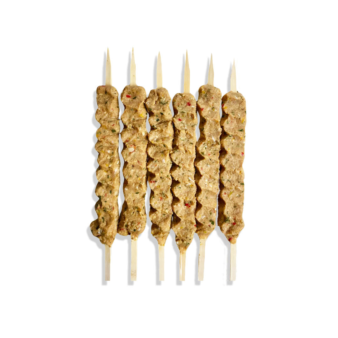 Skewers with meat on a white background