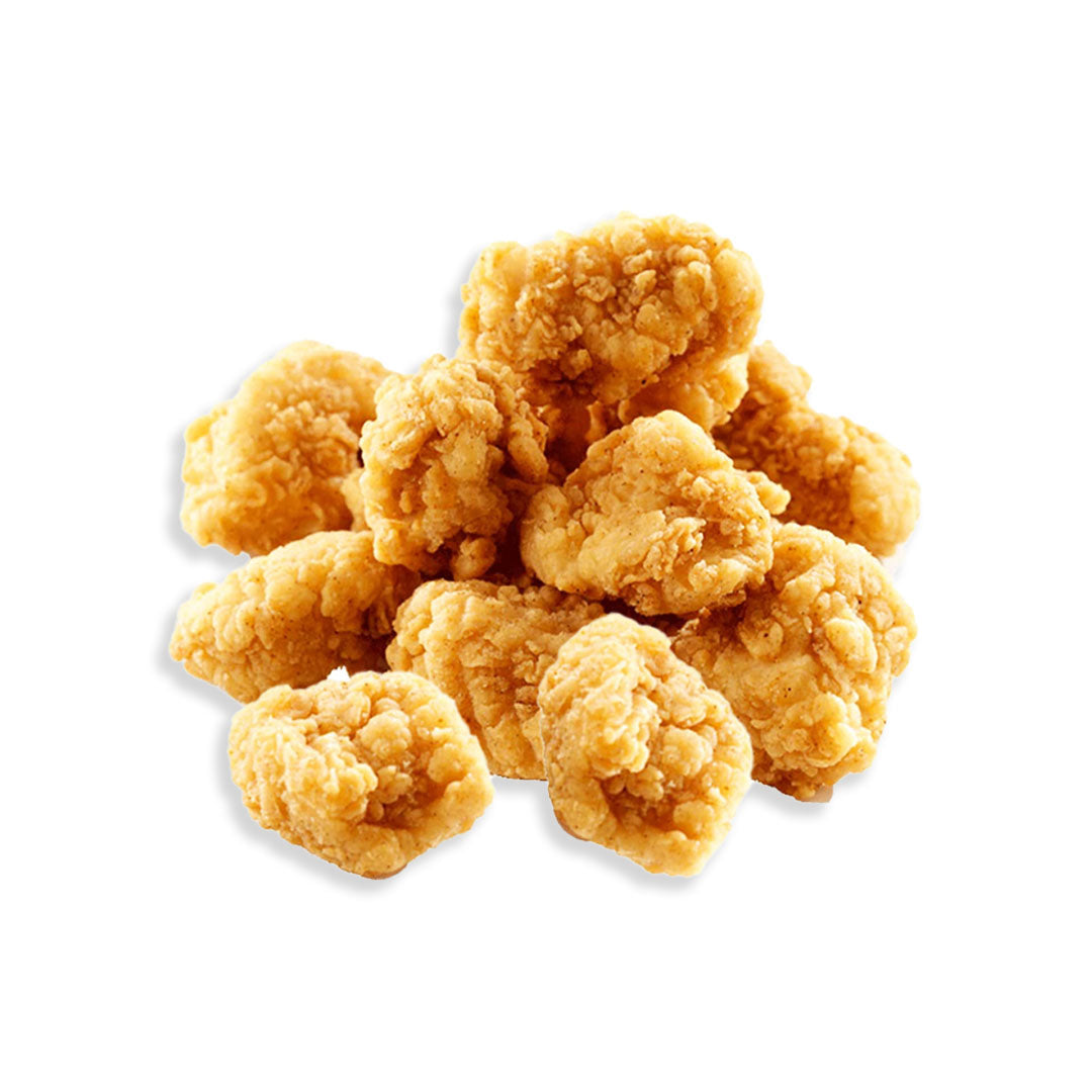 Stack of golden fried chicken pieces on a white background