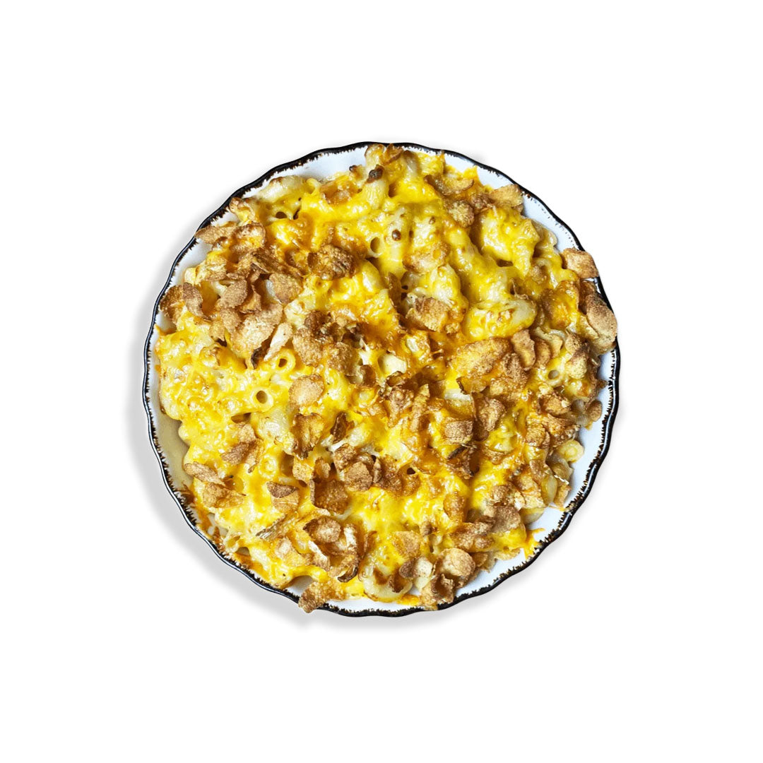 Macaroni and cheese dish on a white plate with a white background