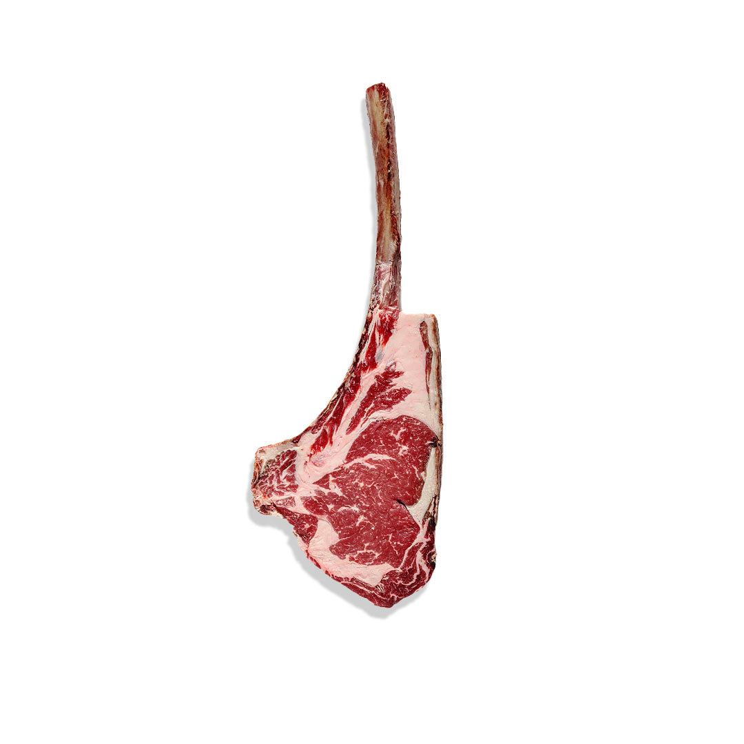 Raw tomahawk steak on a white background