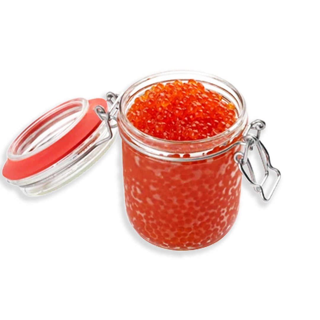 Jar of red caviar with a pink lid on a white background