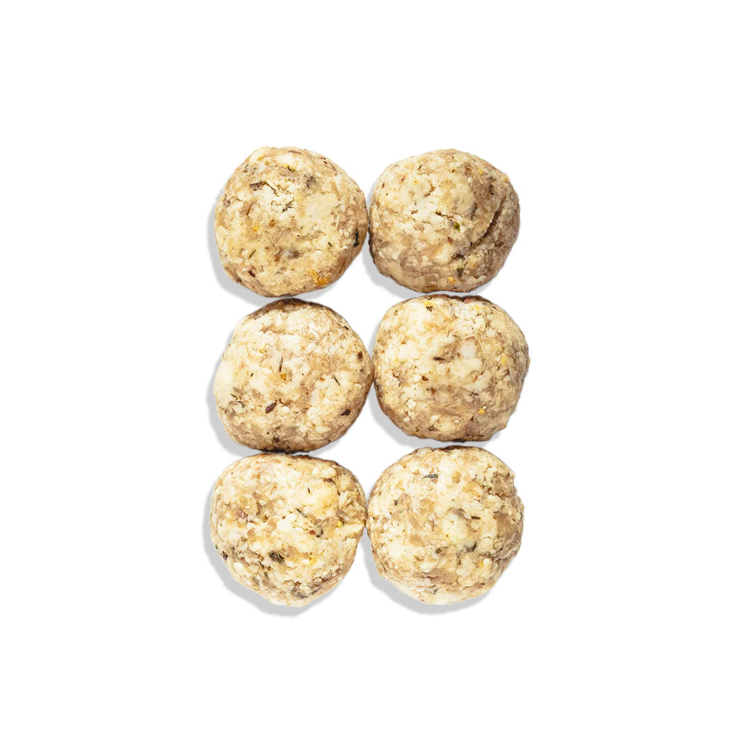 Six round, beige energy balls on a white background