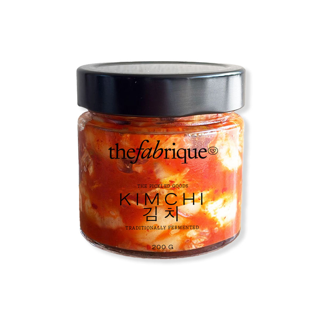 Jar of kimchi with 'thefabrique' branding on a white background