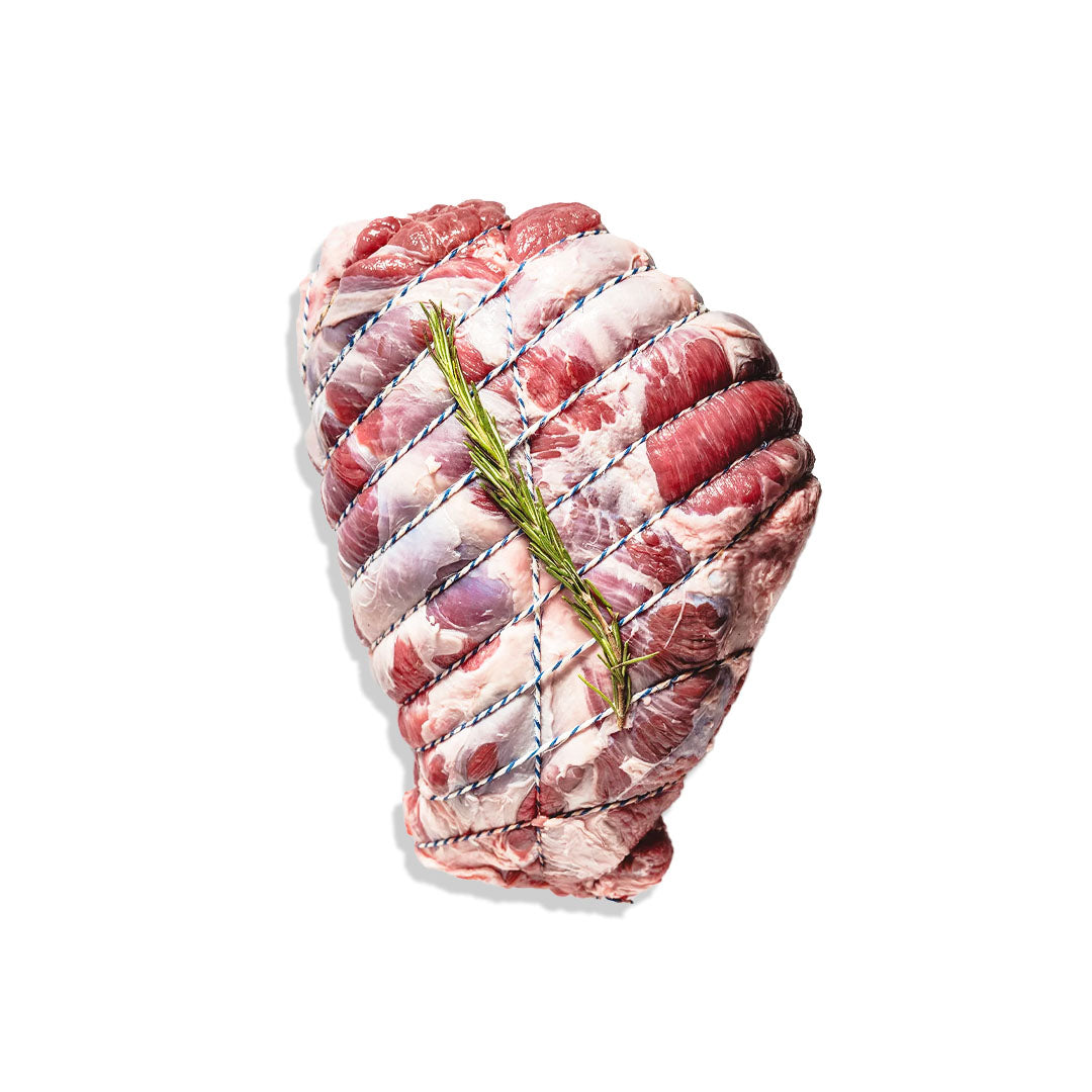 Raw meat with a sprig of rosemary on a white background