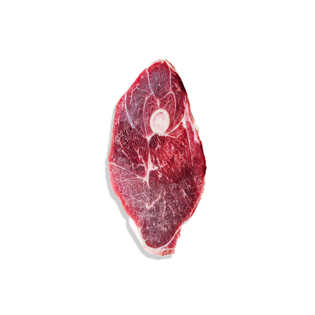 Raw steak on a white background
