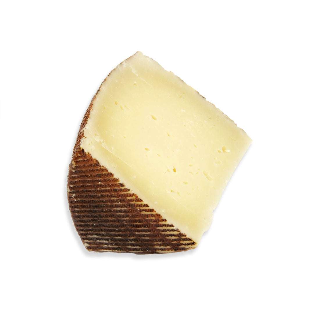 Manchego Semicurado 12-month aged Spanish cheese with firm, buttery texture and nutty flavor