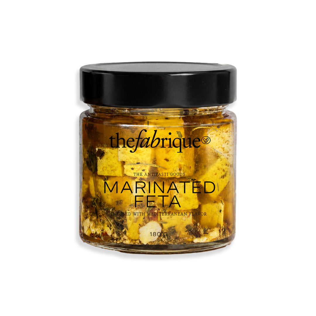 Jar of 'the fabrique' marinated feta cheese on a white background