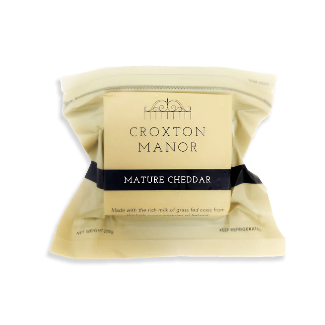 Packaged mature cheddar cheese from Croxton Manor on a white background