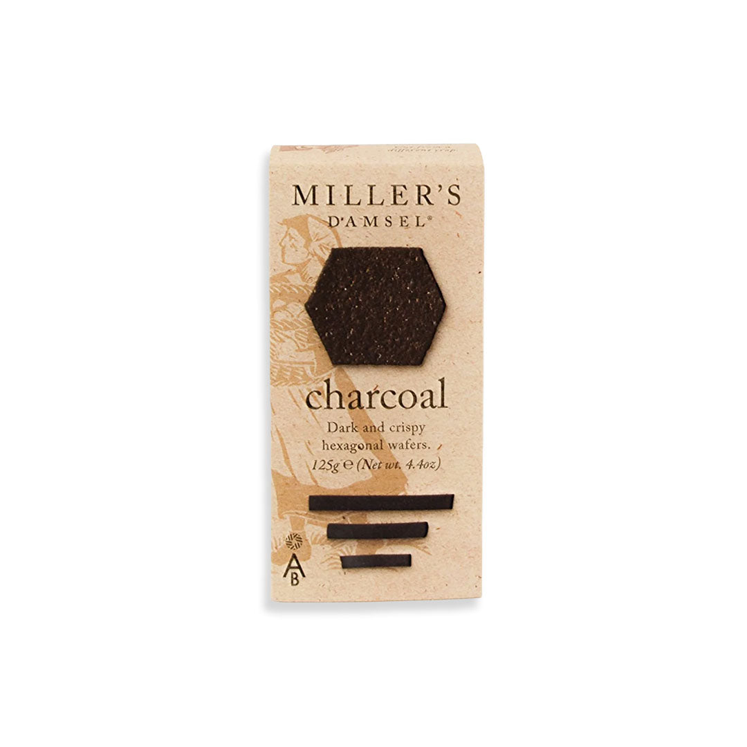 Packaging of Miller's D'amsel charcoal dark chocolate wafers on a white background