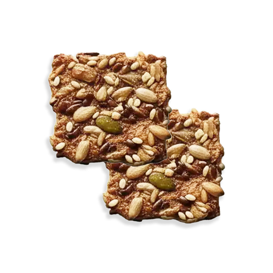 Two square crackers with seeds on a white background