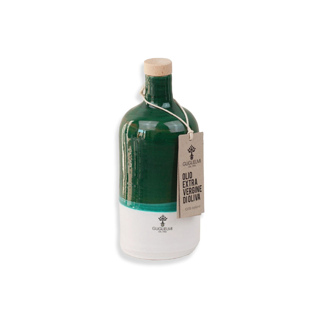Green olive oil bottle with cork lid and tag on a white background