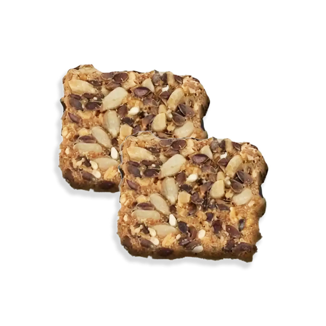 Two granola bars with nuts and chocolate chips on a white background