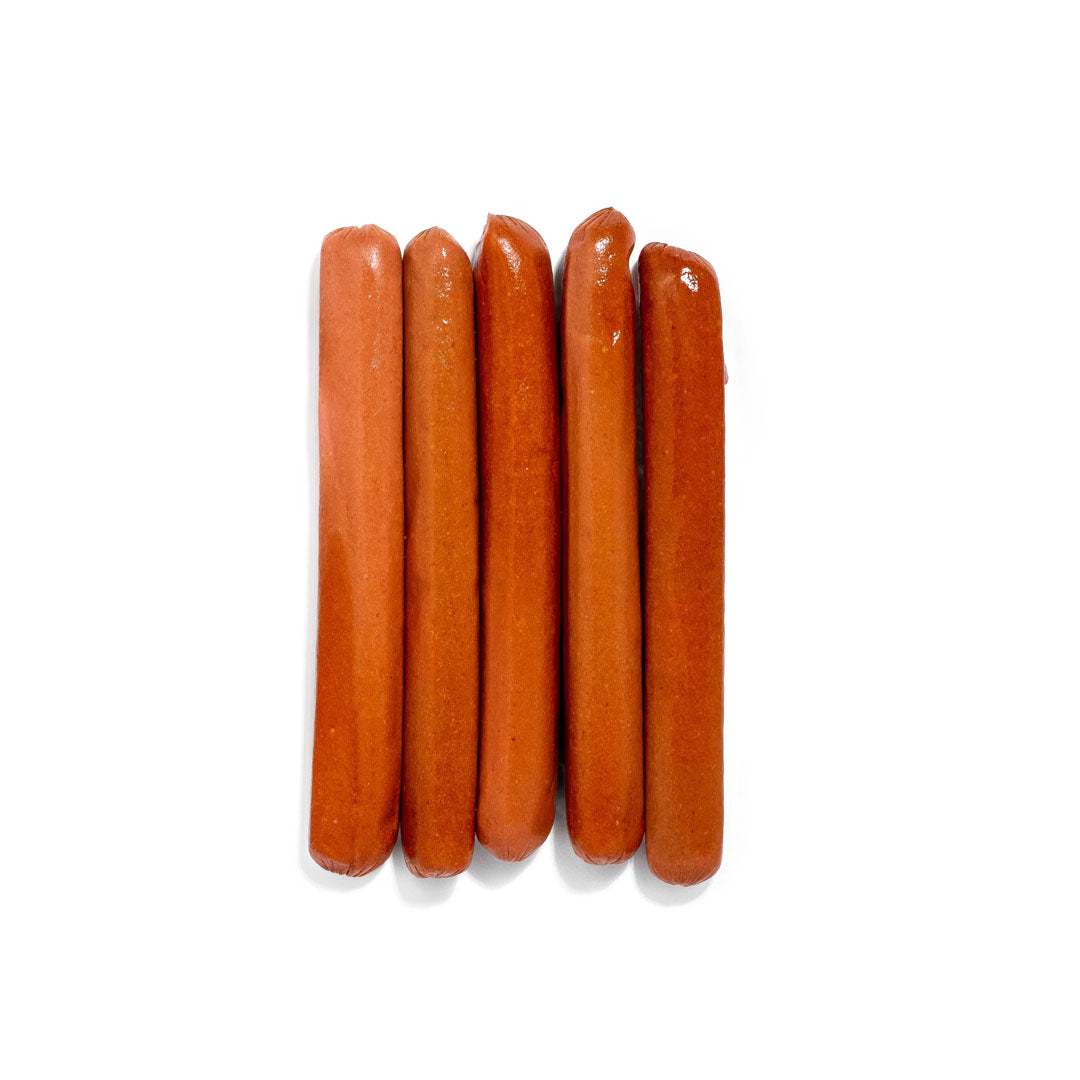 Classic American beef hot dog in a soft bun with mustard and ketchup