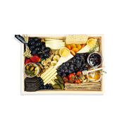 Gourmet food platter with various snacks and fruits in a wooden box.