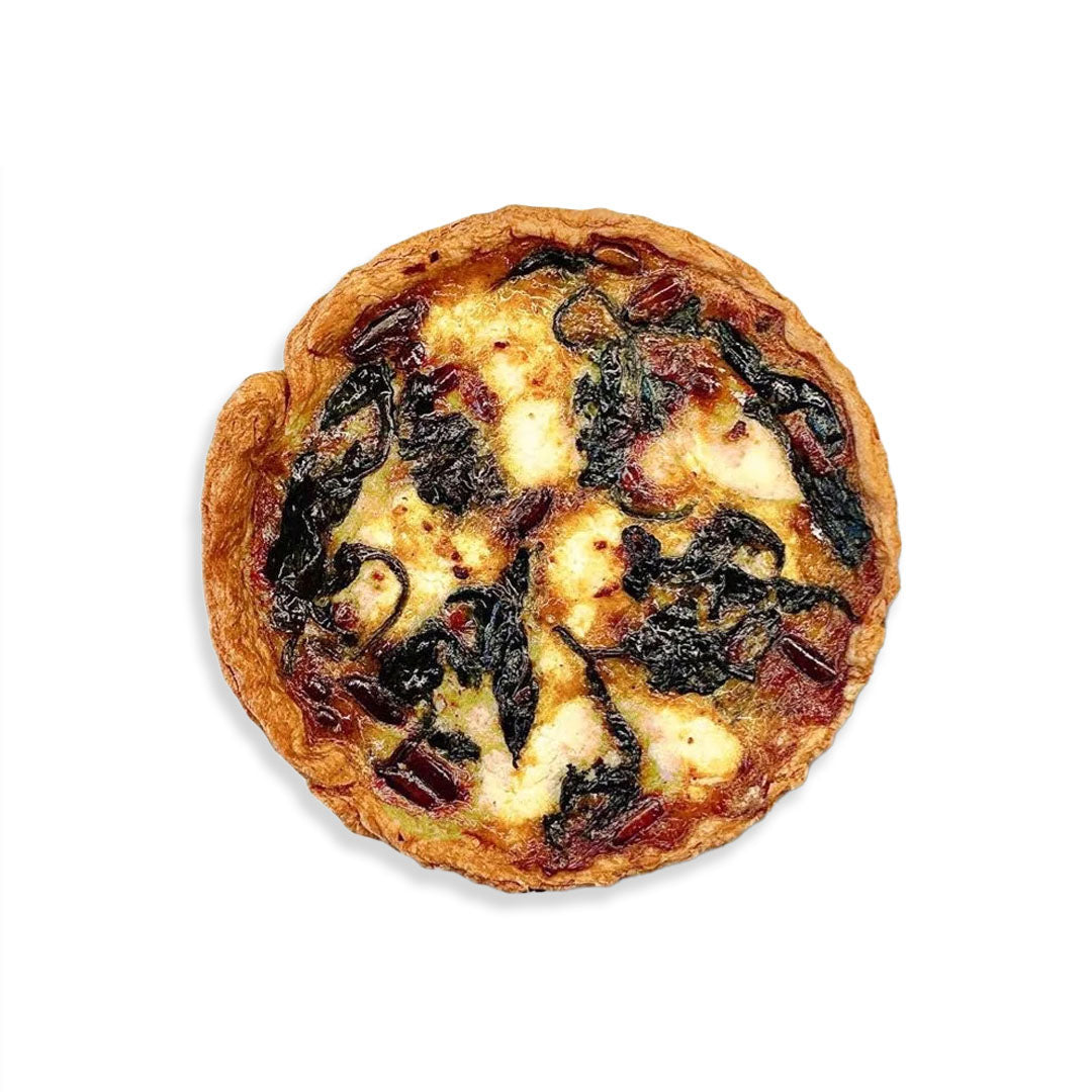 Small pie with cheese and spinach on a white background