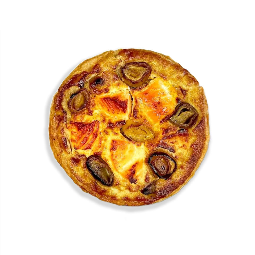 Small pizza with cheese and pickles on a white background