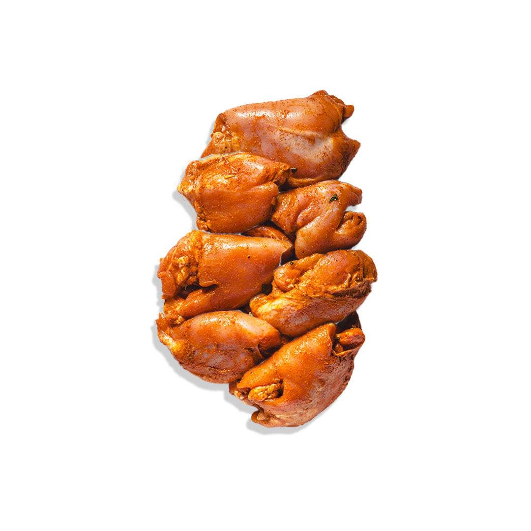 Spicy hormone-free chicken thighs from a local farm, fresh and never frozen, perfect for adding bold flavor to meals