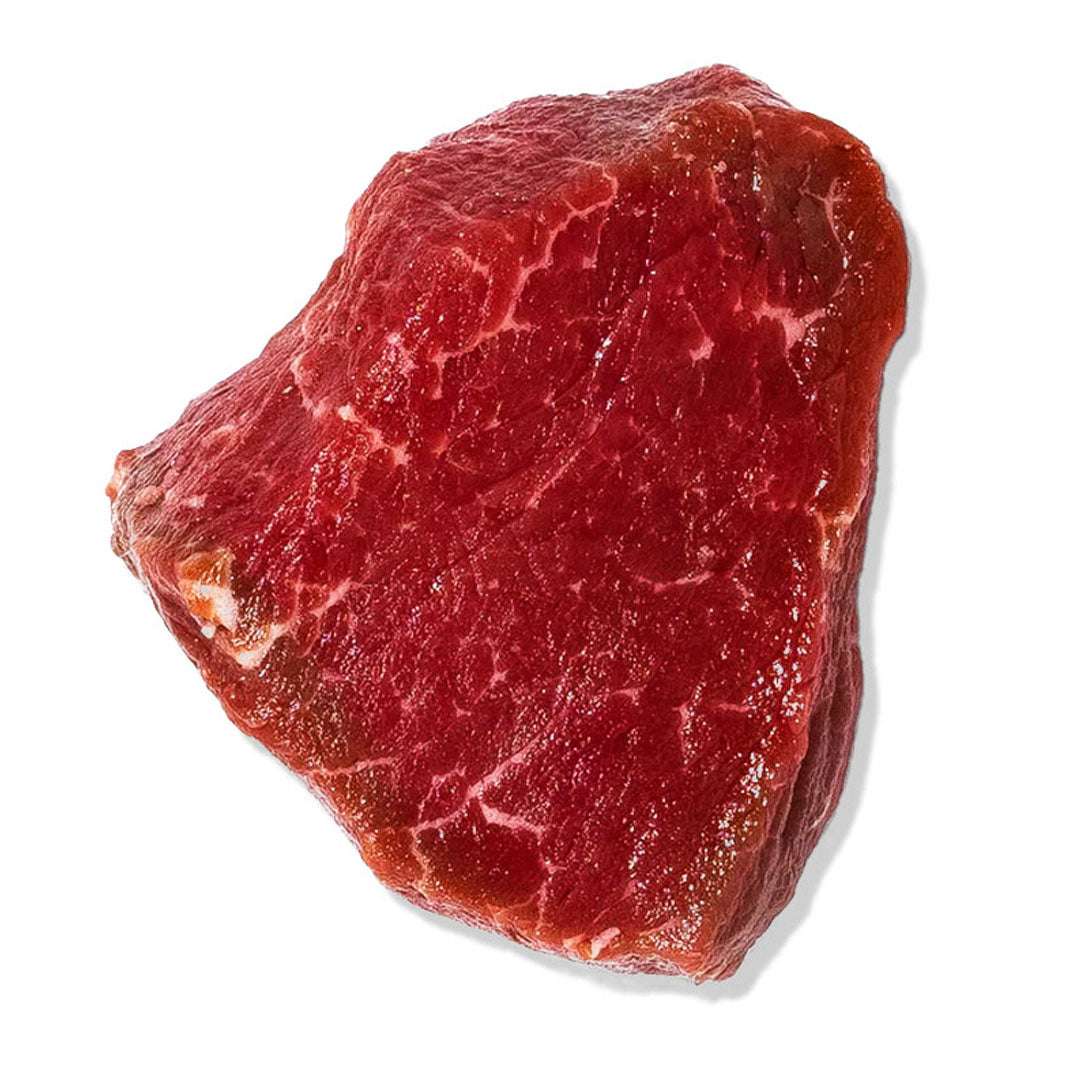 Raw piece of red meat on a white background
