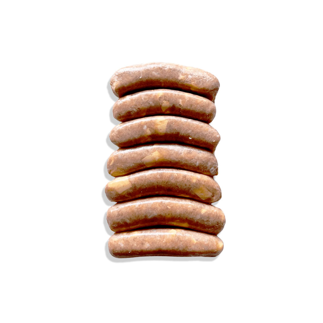 Stack of brown dog treats on a white background