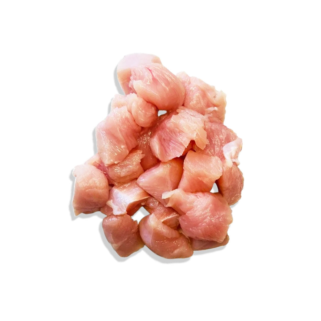 Raw chicken pieces on a white background