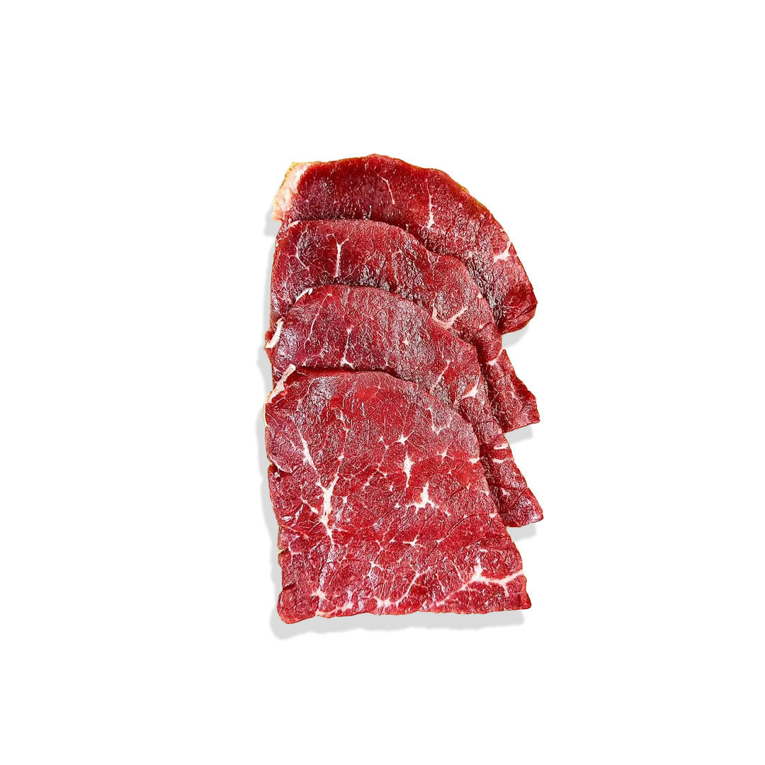 Sliced raw beef on a white background