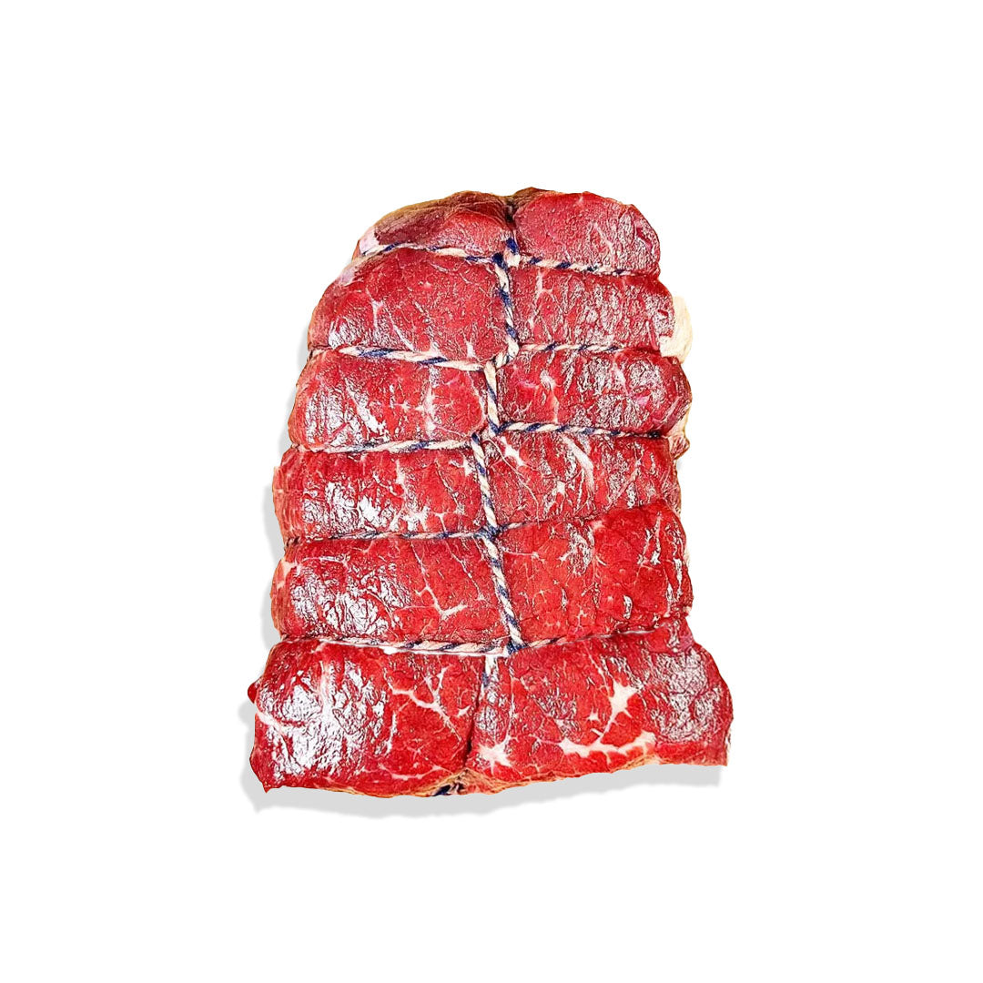 Stack of raw beef on a white background