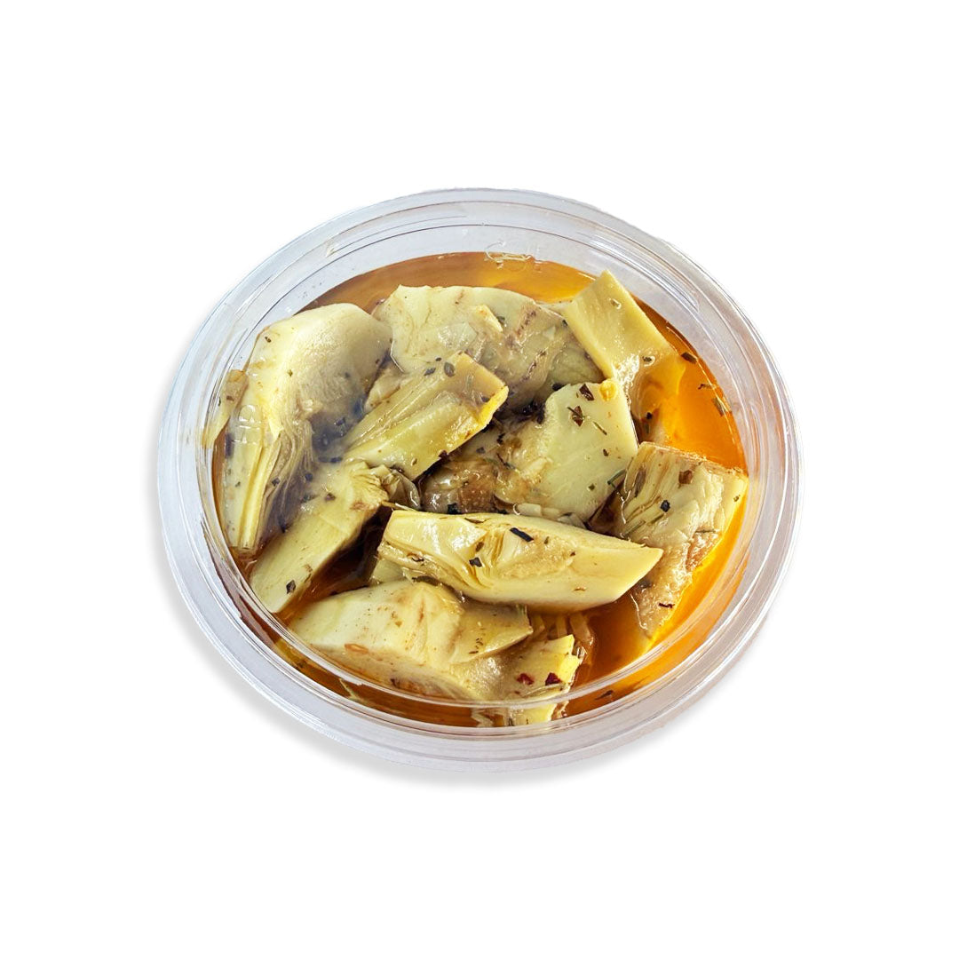 Container of artichoke hearts with a white background