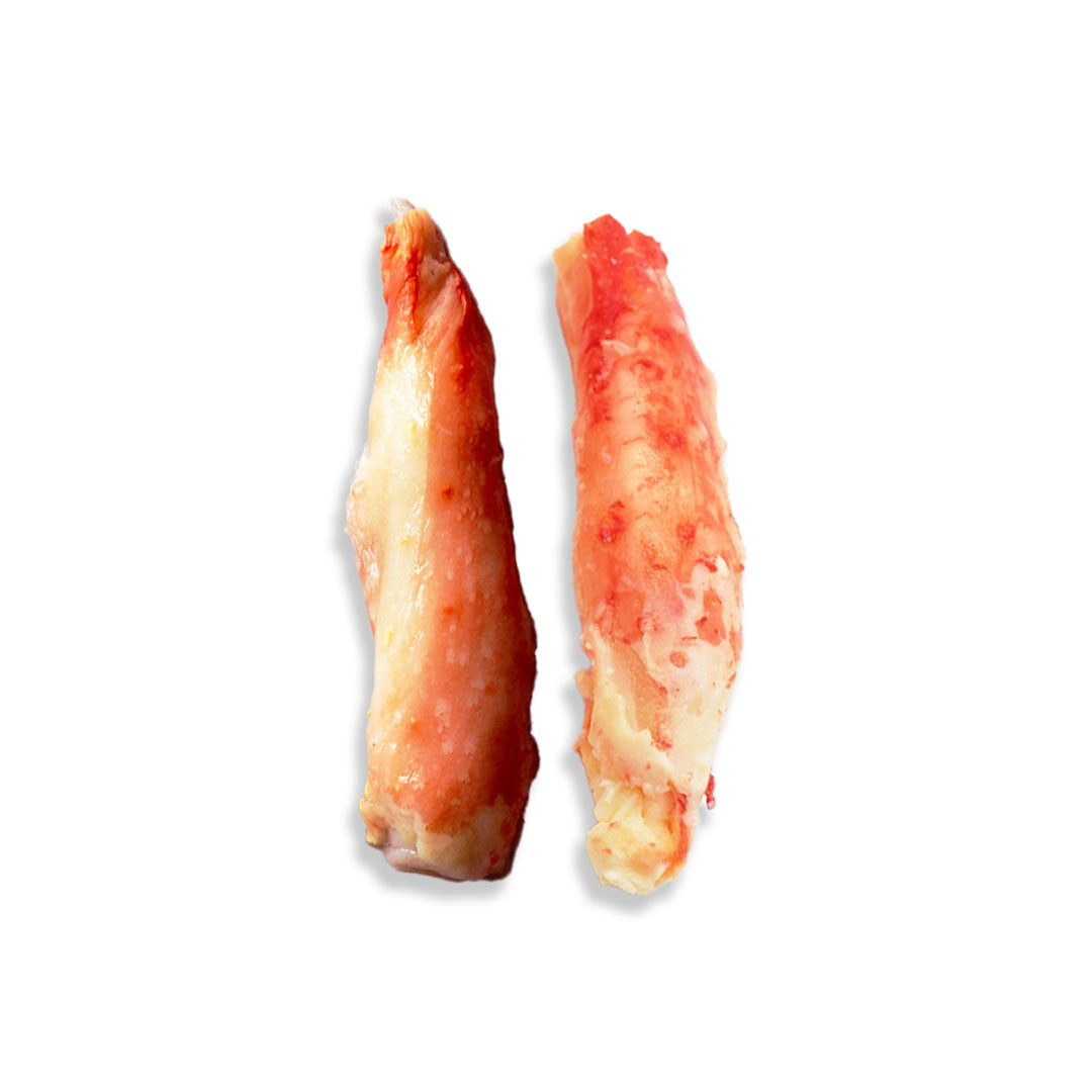 Two raw lobster tails, showing the pinkish-red meat and pale cream-colored shell, set against a plain white background.