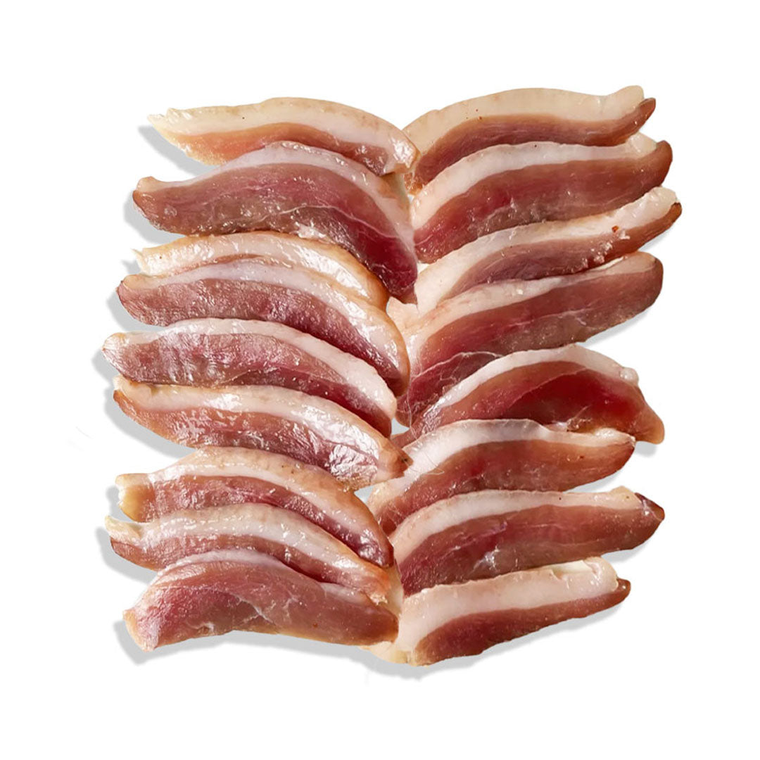 Twelve strips of cured bacon arranged in two vertical columns on a plain white background.