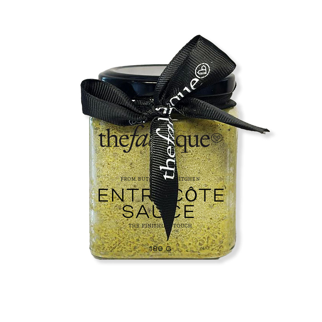 Jar of Entree Cote Sauce with a black ribbon on a white background