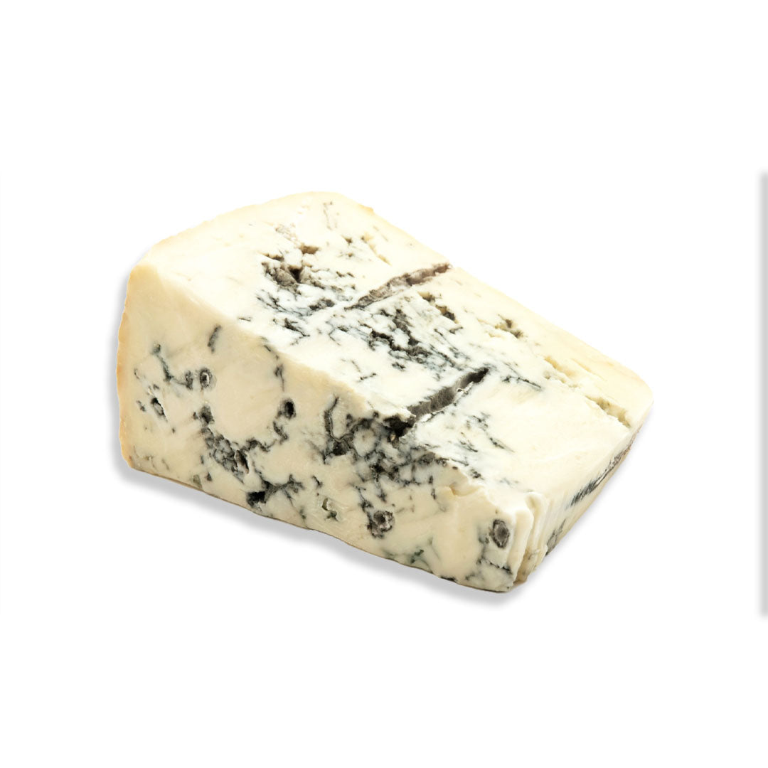 A wedge of blue cheese with creamy off-white curds and dark blue-gray moldy streaks, photographed on a plain white background.