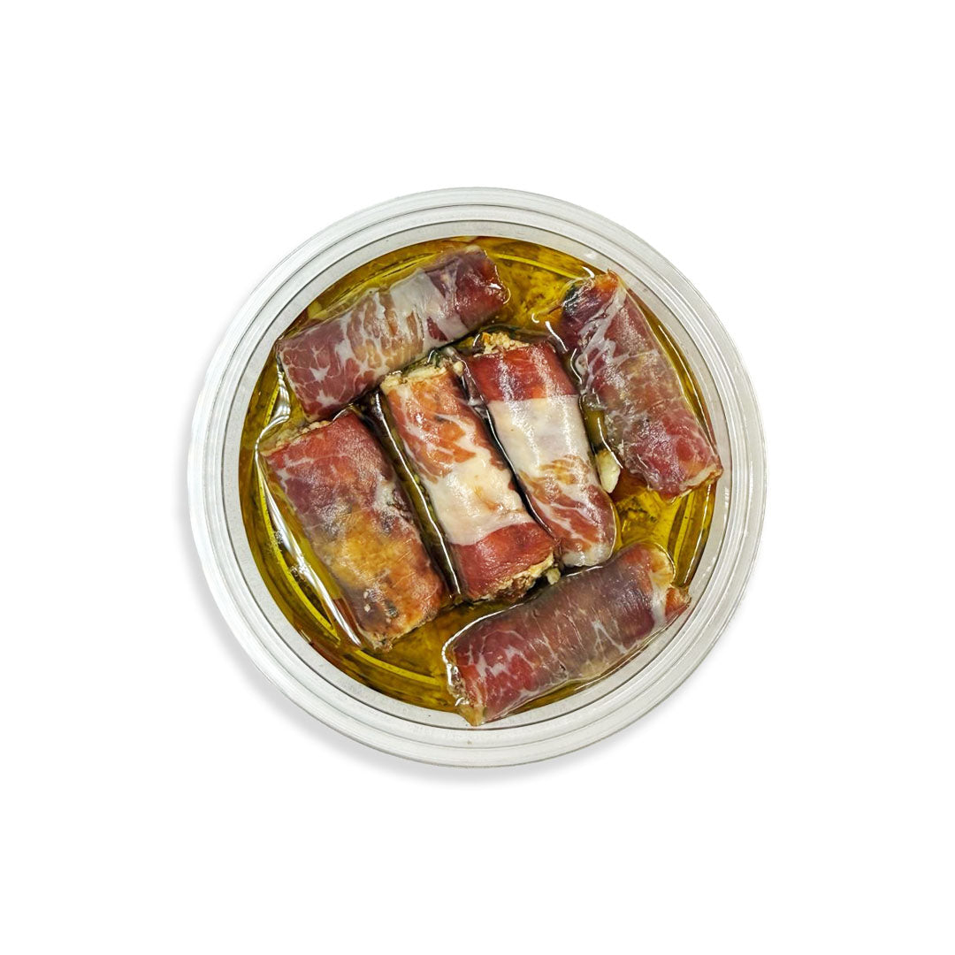 Dried iberian igs in olive oil on a white background