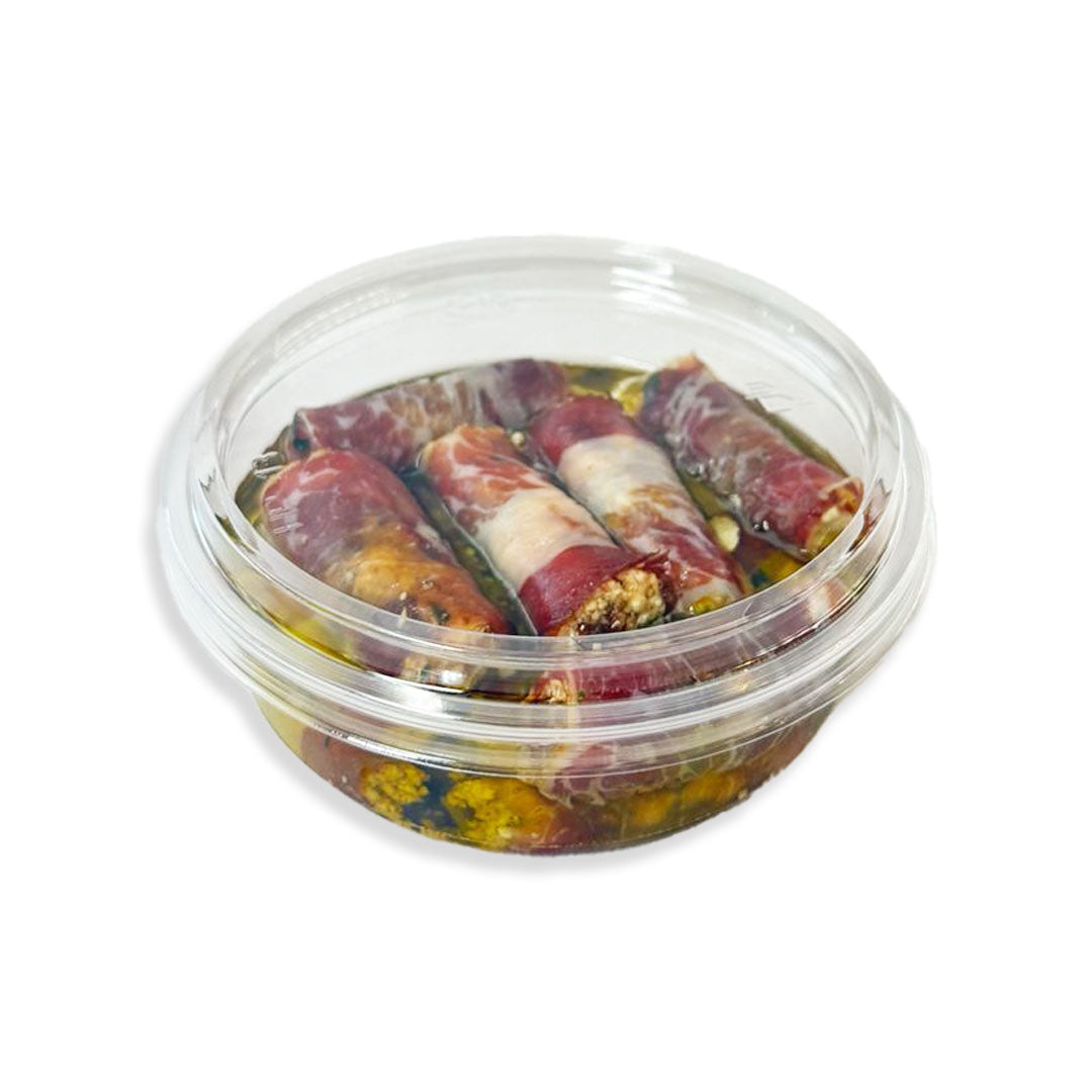 Clear plastic container with food items on a white background