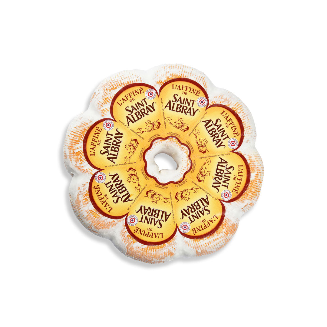 A flower-shaped cheese wheel from Saint Albry Laffine, featuring yellow and orange labels with the brand name 'Saint Albry' and 'Laffine' printed on each petal, set against a plain white background.