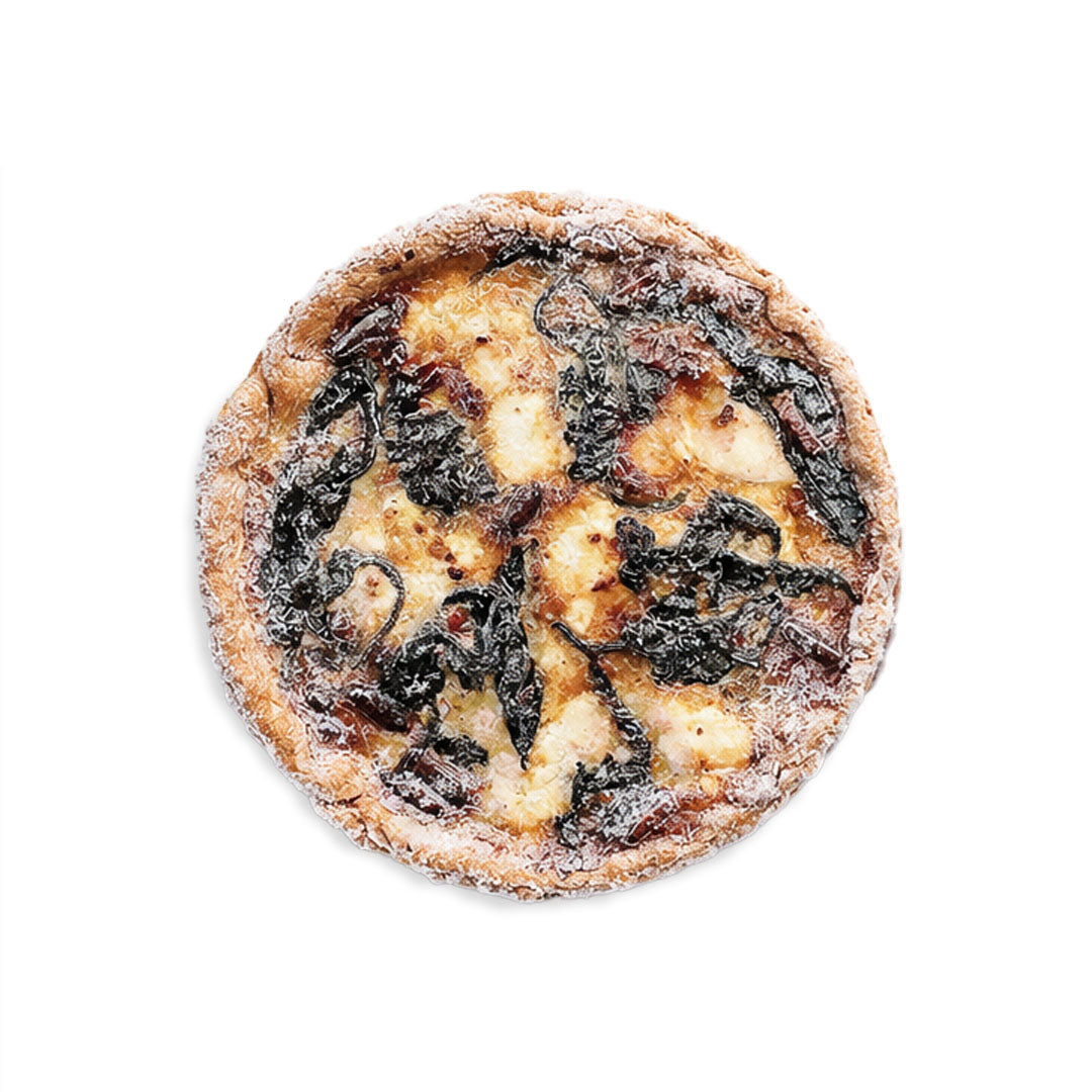 Small pastry with dark filling on a white background